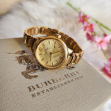  Shop Authentic Burberry The Classic Champagne Dial Gold Steel Strap Watch for Women - BU10109 - Luxxuri