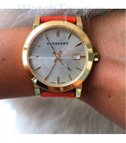  Shop Authentic Burberry The City Gold Dial Orange Leather Strap Watch for Women - BU9016 - Luxxuri