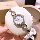  Shop Authentic Bulova Crystals Mother of Pearl Dial Two Tone Steel Strap Watch for Women - 98X108 - Luxxuri