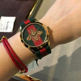  Shop Authentic Gucci Le Marche des Merveilles Green & Red Dial Green & Red NATO Strap Unisex Watch - YA126487 - Luxxuri